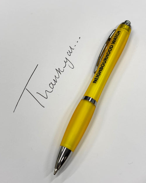A yellow Neighbourhood Watch branded pen