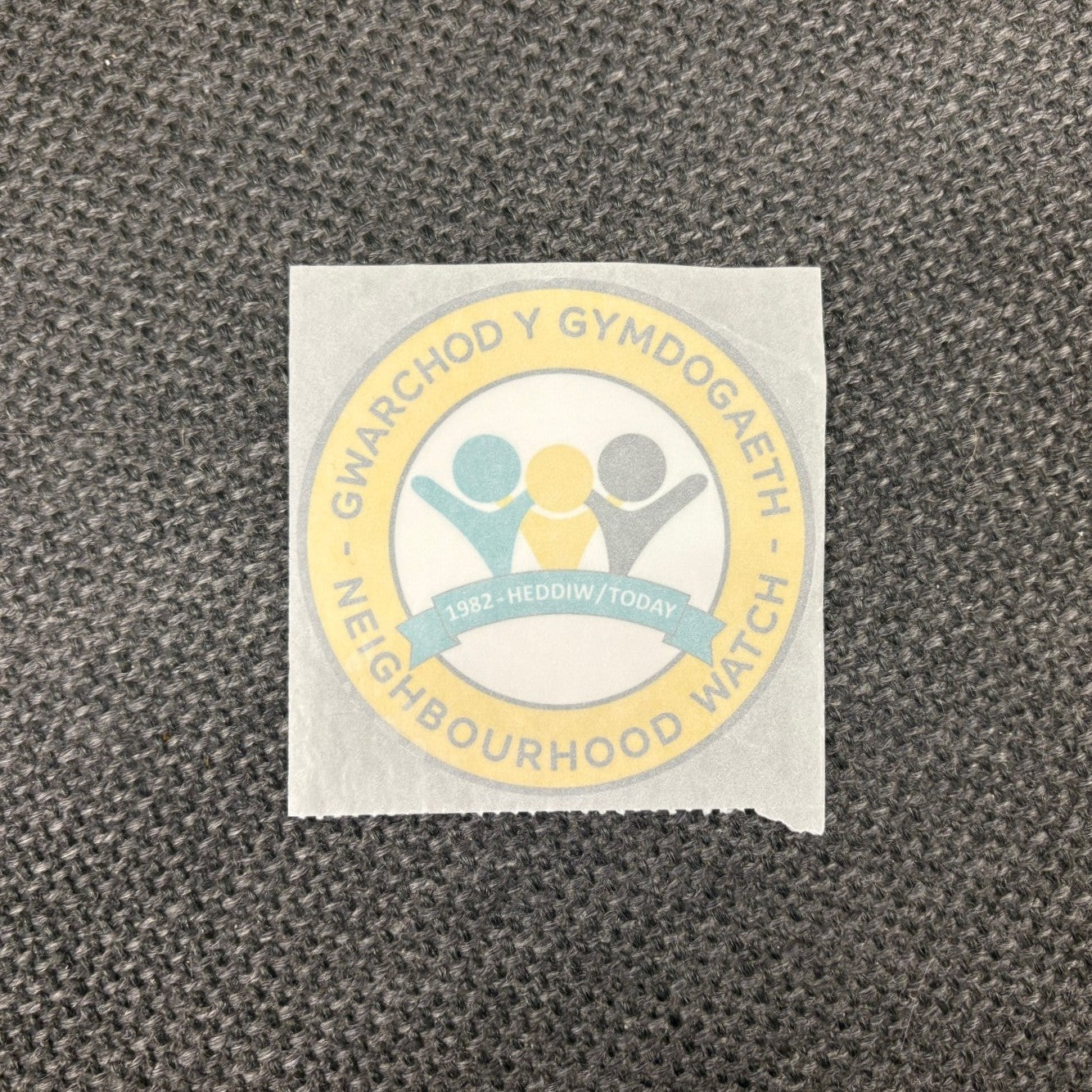 Pack of 50 Neighbourhood 'today' logo window stickers in Welsh/English, Alert logo on back